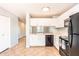 Functional kitchen with white cabinets and black appliances at 1793 S Valley Dr, Apache Junction, AZ 85120