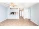 Open-concept living area featuring tile flooring, a ceiling fan, and a pass-through to the kitchen at 1793 S Valley Dr, Apache Junction, AZ 85120