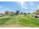 A view of the park's playground and basketball court at 1793 S Valley Dr, Apache Junction, AZ 85120