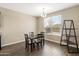 Bright dining area with wood-look tile flooring and a chandelier at 18382 N Arbor Dr, Maricopa, AZ 85138