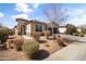 Beautiful desert landscaped front yard with walkway leading to the front door at 18382 N Arbor Dr, Maricopa, AZ 85138