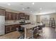 Modern kitchen with granite countertops, stainless steel appliances, and a large center island at 18382 N Arbor Dr, Maricopa, AZ 85138