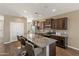 Spacious kitchen featuring granite countertops, ample cabinetry, and modern appliances at 18382 N Arbor Dr, Maricopa, AZ 85138