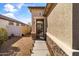 Cozy side yard with gravel, walkway, and secure gate for added privacy at 18382 N Arbor Dr, Maricopa, AZ 85138