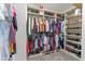 Spacious walk-in closet with custom shelving for shoes, clothes and accessories at 18382 N Arbor Dr, Maricopa, AZ 85138