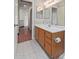 Bathroom featuring a neutral color palette, unique patterned tile flooring, and a spacious vanity at 18608 N 4Th Ave, Phoenix, AZ 85027