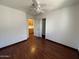 This bedroom features hardwood floors, a closet, and a glimpse into an adjacent room at 18608 N 4Th Ave, Phoenix, AZ 85027