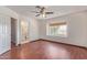 Bedroom with wood floors, a ceiling fan, and an ensuite bathroom for added convenience at 18608 N 4Th Ave, Phoenix, AZ 85027