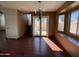 The dining room is bright with natural light, featuring wood floors and a chandelier at 18608 N 4Th Ave, Phoenix, AZ 85027