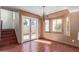 Dining room with laminate flooring, natural lighting, and adjacent staircase at 18608 N 4Th Ave, Phoenix, AZ 85027