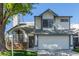 Charming two-story home featuring a two-car garage, mature landscaping, and a well-maintained front yard at 18608 N 4Th Ave, Phoenix, AZ 85027