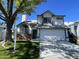 Charming two-story home featuring a well-manicured lawn, a two-car garage, and a classic architectural design at 18608 N 4Th Ave, Phoenix, AZ 85027