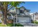 Charming two-story home featuring a two-car garage, mature landscaping, and a well-maintained front yard at 18608 N 4Th Ave, Phoenix, AZ 85027