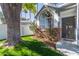 View of home from the yard, featuring a mature tree, window box and a well-manicured lawn at 18608 N 4Th Ave, Phoenix, AZ 85027