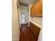 Hallway with oak cabinets that leads to a bathroom at 18608 N 4Th Ave, Phoenix, AZ 85027