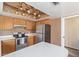 Kitchen features white countertops, wood cabinets, and stainless steel appliances at 18608 N 4Th Ave, Phoenix, AZ 85027