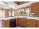 Kitchen features oak cabinets, white counters, a dual sink, and a breakfast bar at 18608 N 4Th Ave, Phoenix, AZ 85027