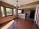 Bright kitchen with stainless steel appliances, oak cabinetry, a breakfast bar, and chandelier at 18608 N 4Th Ave, Phoenix, AZ 85027