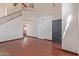 Bright living room with high ceilings, dark wood-look flooring, and a gray front door at 18608 N 4Th Ave, Phoenix, AZ 85027