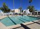 Community pool with crystal-clear water, lounge seating, and a meticulously maintained surrounding area at 18608 N 4Th Ave, Phoenix, AZ 85027