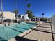 Community pool with crystal-clear water, lounge seating, and a meticulously maintained surrounding area at 18608 N 4Th Ave, Phoenix, AZ 85027