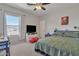 Comfortable bedroom with a large window and natural light at 2013 E Dust Devil Dr, San Tan Valley, AZ 85143