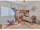 Cozy bedroom featuring bunk beds and a comfortable hanging chair at 2013 E Dust Devil Dr, San Tan Valley, AZ 85143