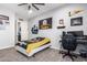 Nicely decorated bedroom with ceiling fan, wall decor, desk and computer at 21717 W South Mountain Ave, Buckeye, AZ 85326