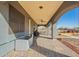 Extended covered patio area with stone floors, offering ample shade and outdoor living space at 21717 W South Mountain Ave, Buckeye, AZ 85326