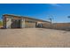 Spacious three car garage and basketball court perfect for storing vehicles and outdoor activities at 21717 W South Mountain Ave, Buckeye, AZ 85326