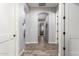 Inviting hallway features archways and wood flooring, creating a seamless transition between rooms at 21717 W South Mountain Ave, Buckeye, AZ 85326