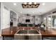 Close up on kitchen island with stainless steel sink and view of living area at 21717 W South Mountain Ave, Buckeye, AZ 85326