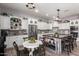 Bright kitchen with stainless steel appliances, custom cabinetry, and a center island with bar seating at 21717 W South Mountain Ave, Buckeye, AZ 85326