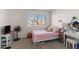 Bright bedroom with playful decor, a cozy bed, and a functional vanity area at 222 W Brown Rd # 57, Mesa, AZ 85201