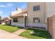 Charming exterior featuring a well-kept lawn and a tiled roof, creating a welcoming atmosphere at 222 W Brown Rd # 57, Mesa, AZ 85201