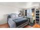 This bedroom offers a serene retreat with a vanity, natural light, and laminate flooring at 222 W Brown Rd # 57, Mesa, AZ 85201