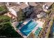 Aerial view of the property highlighting the pool area, outdoor seating, mature trees, and surrounding landscape at 2233 N 9Th Ave, Phoenix, AZ 85007