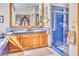 An elegant bathroom showing a double vanity, with bright blue tile accents, and glass enclosed shower at 2233 N 9Th Ave, Phoenix, AZ 85007