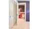 Vintage style bathroom with red and white tile, striped wallpaper and period-appropriate fixtures at 2233 N 9Th Ave, Phoenix, AZ 85007