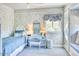 Charming bedroom featuring blue decor, a vanity, and a built-in window seat for relaxing at 2233 N 9Th Ave, Phoenix, AZ 85007