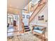 Elegant home foyer featuring a grand staircase, hardwood floors, custom millwork, and tasteful decor at 2233 N 9Th Ave, Phoenix, AZ 85007