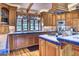 Traditional kitchen with blue tile countertops, wooden cabinets, stainless steel appliances and hardwood floors at 2233 N 9Th Ave, Phoenix, AZ 85007