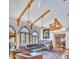 Bright living room with vaulted ceilings, exposed beams, arched windows, and elegant furnishings at 2233 N 9Th Ave, Phoenix, AZ 85007