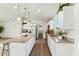 Modern kitchen with white cabinetry, stainless steel appliances and large kitchen island at 24942 S 190Th Dr, Buckeye, AZ 85326