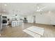 Spacious living area featuring an island kitchen with seating, a dining area, and lots of natural light at 24942 S 190Th Dr, Buckeye, AZ 85326