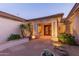 Beautiful stone walkway leading to a covered entry featuring double doors with decorative ironwork at 2625 W Oakland St, Chandler, AZ 85224