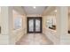 Elegant foyer featuring tile flooring and decorative double doors, leading into the home at 2625 W Oakland St, Chandler, AZ 85224