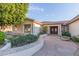 Well-maintained home with desert landscaping leading to the entryway at 2625 W Oakland St, Chandler, AZ 85224