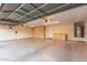 Spacious garage with ample storage cabinets and epoxy flooring at 2625 W Oakland St, Chandler, AZ 85224