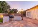 Backyard view highlighting an outdoor kitchen area and hardscape at 2625 W Oakland St, Chandler, AZ 85224